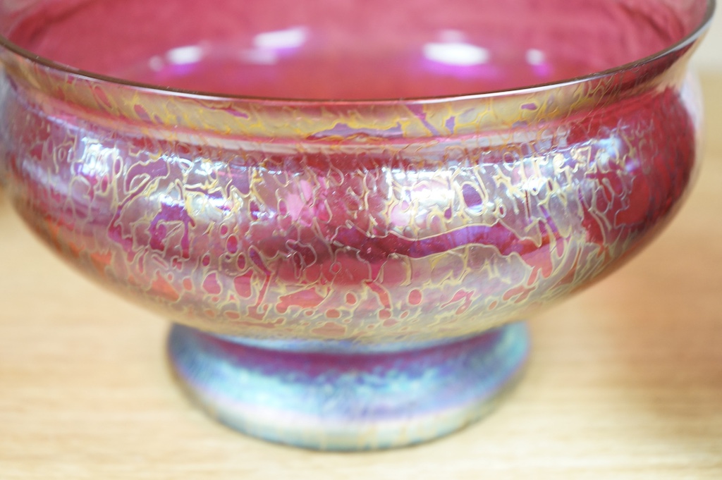 An iridescent art glass pedestal bowl and similar vase, bowl 20cm diameter. Condition - good